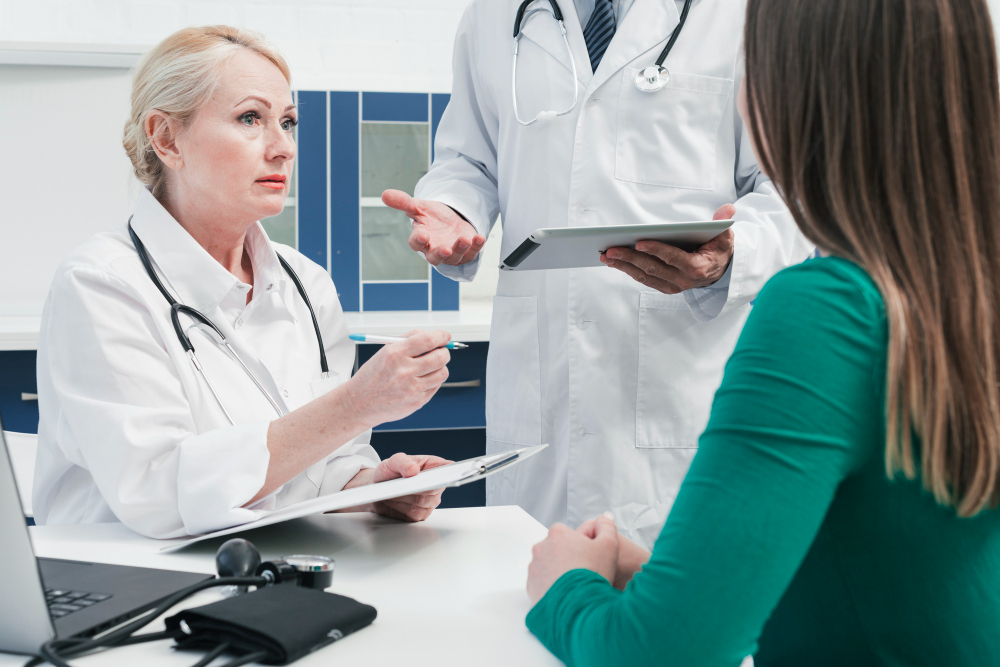 Physicians discussing a care plan with a patient